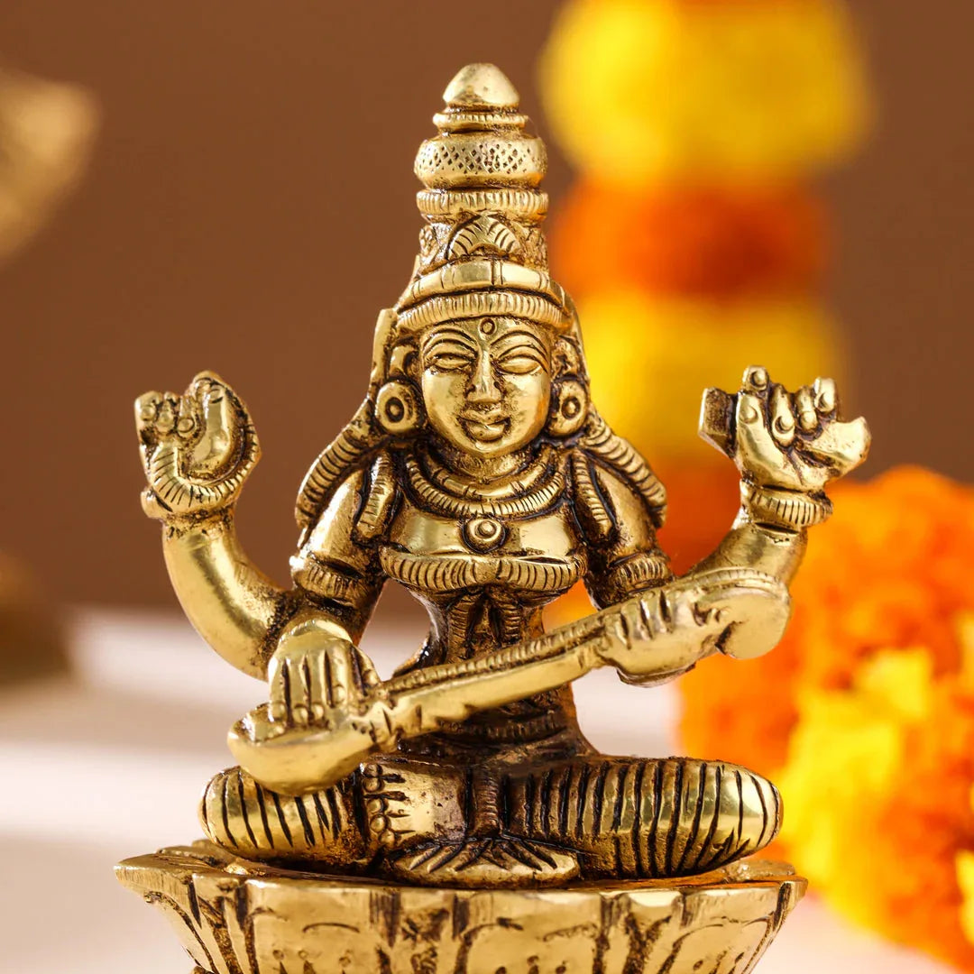 Brass Saraswati idol playing veena-artycraftz.com