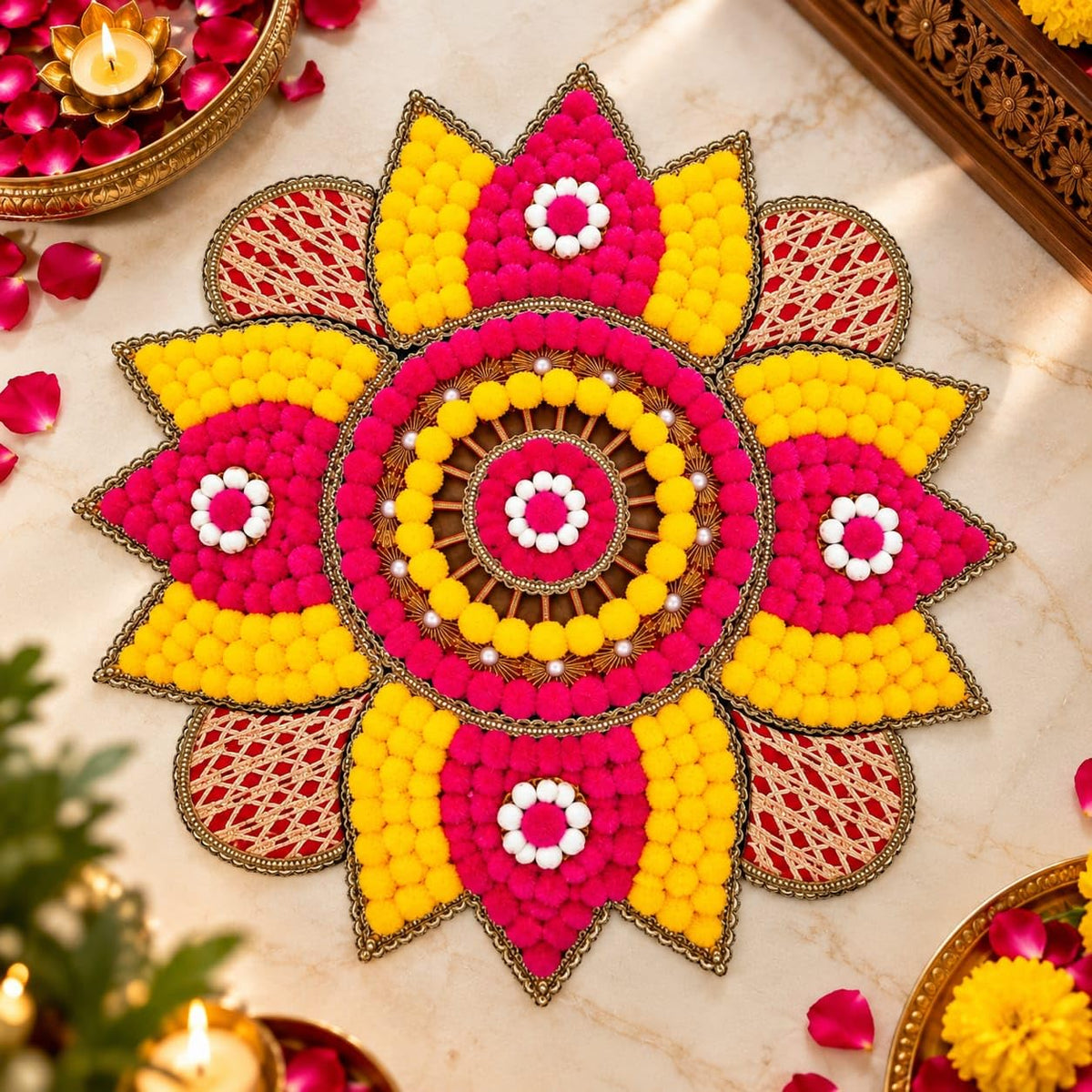 Pink and yellow handcrafted floral rangoli mat with white pom-pom details and decorative gold-tone border, 18 inch-artycraftz.com