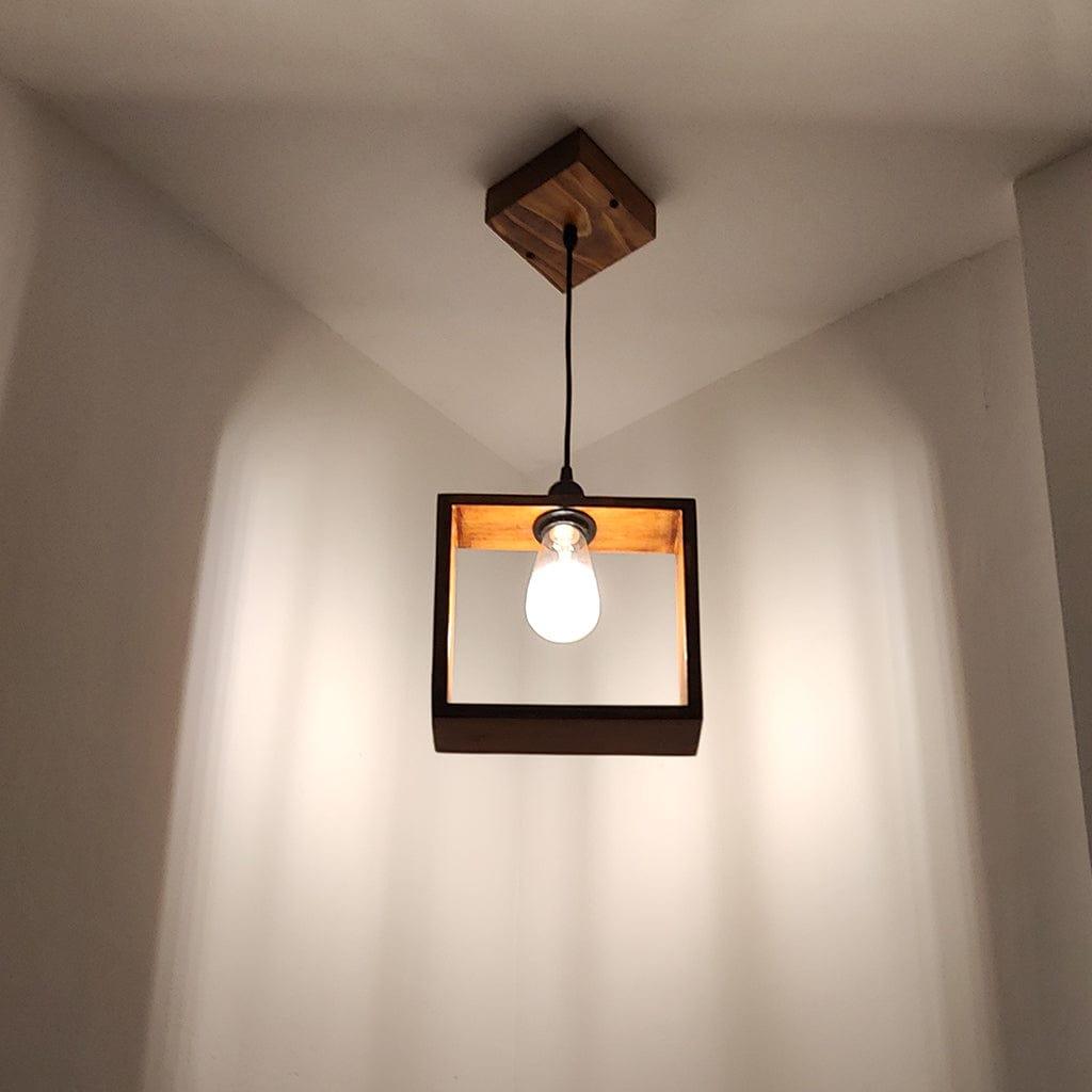 Wooden pendant light fixture with a bulb hanging from the ceiling.
