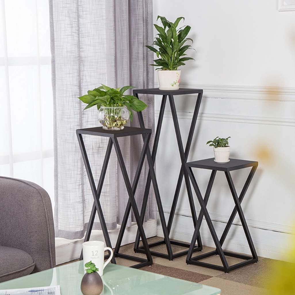 Set of three black iron plant stands with modern X-shaped frames in small, medium and large sizes.-artycraftz.com