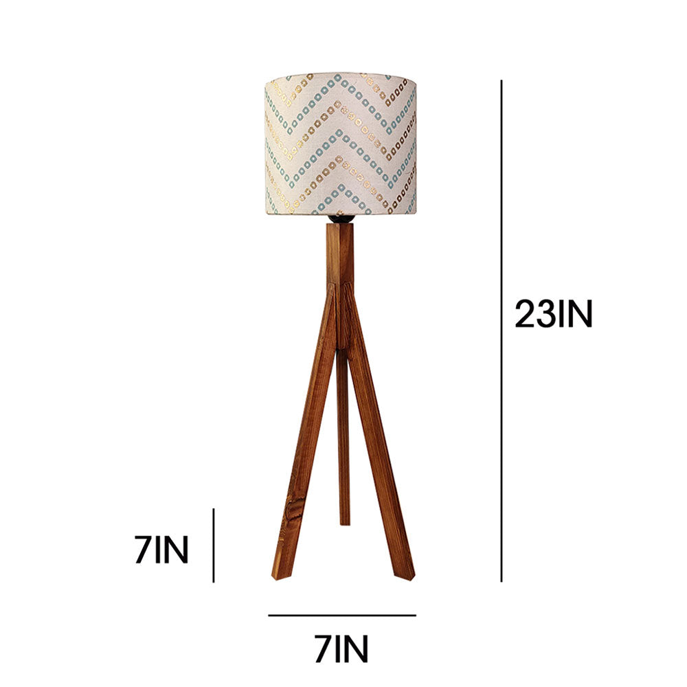 Wooden tripod lamp with patterned fabric shade and dimensions on a white background