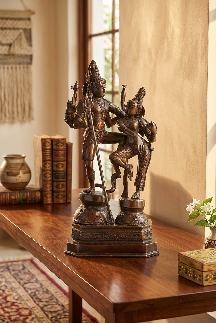 Dark antique-finish brass statue of Shiva and Parvati dancing together with a Trishul and ornate pedestal-artycraftz.com