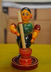 Handcrafted Kondapalli Wooden Lady With A Rice Pounder