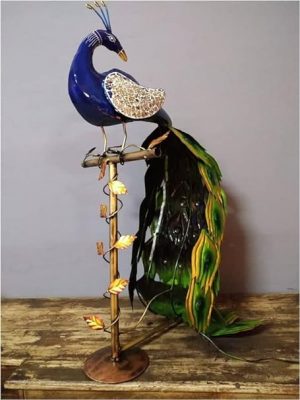 Metal Peacock on branch