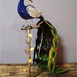 Metal Peacock on branch